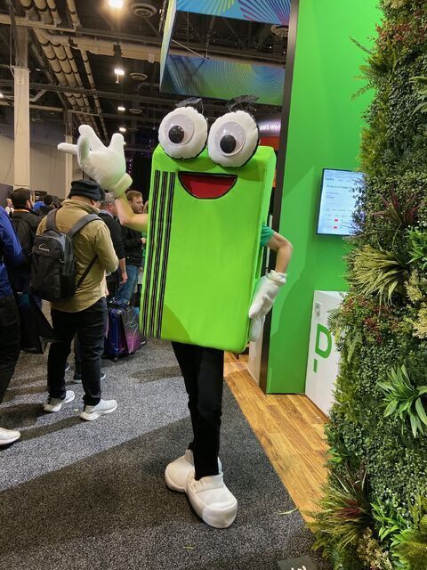 PagerDuty mascot, Pagey, on the event floor at KubeCon in Amsterdam. Pagey is an anthropomorphized telecom pager with large googly eyes.